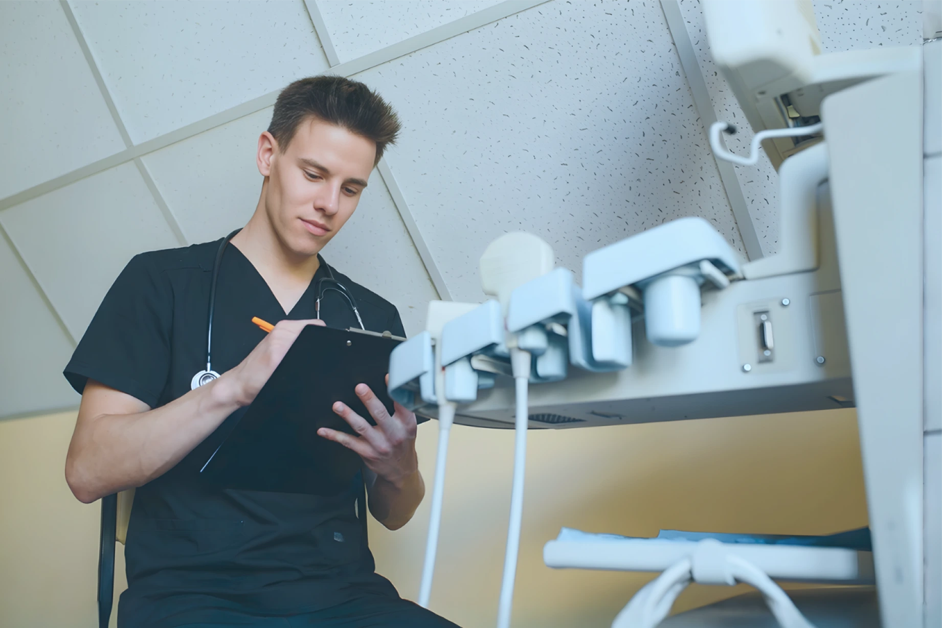 An Ally Medical ER staff member taking notes on a clipboard